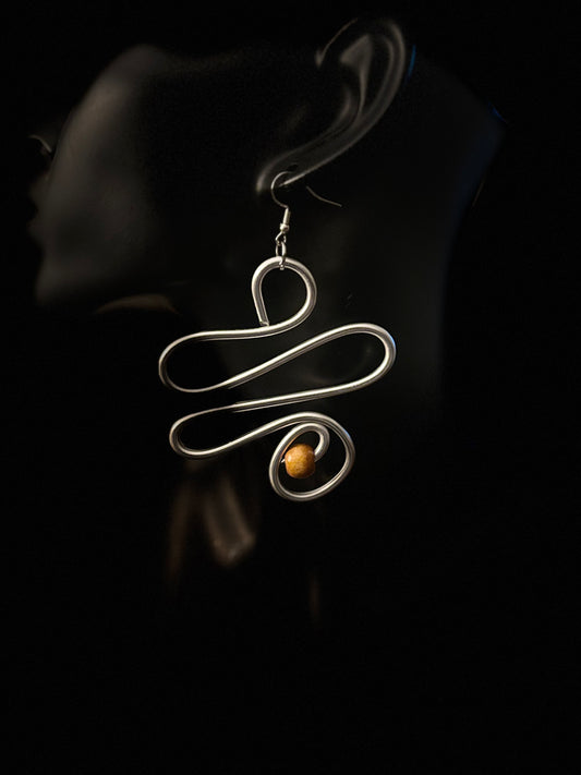 Perfect for someone who values individuality, movement, and understated statement pieces.