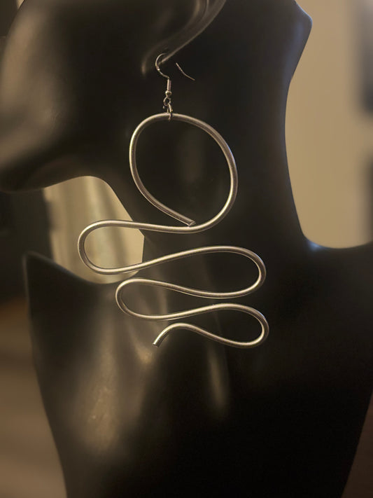 This earring belongs to a woman who understands that freedom is the most powerful form of elegance. 